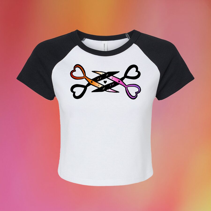 Black and white raglan baby tee printed with heart-handled scissors in lesbian flag colours
